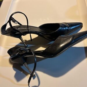 Black stiletto with silver heel. Size 7.5.